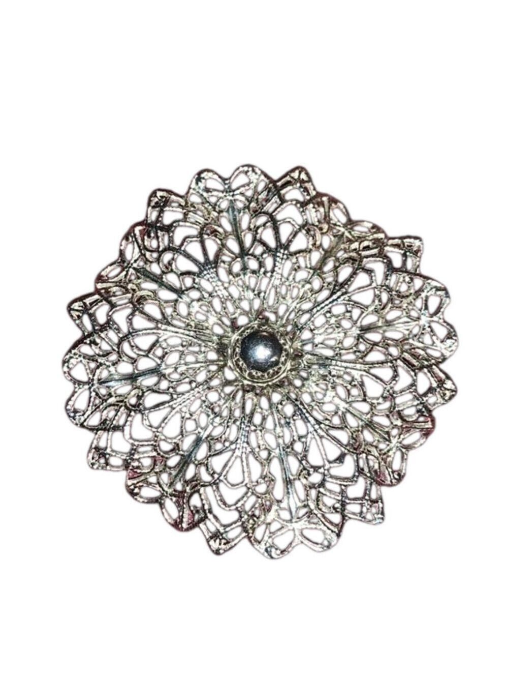 Silver tone filigree brooch
